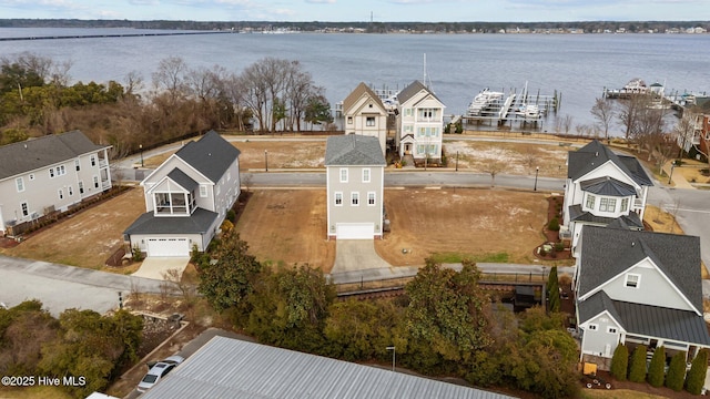 birds eye view of property featuring a water view