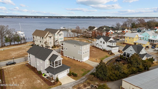 aerial view with a water view and a residential view