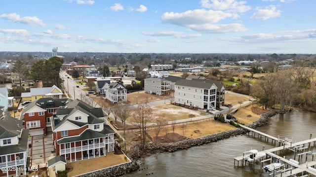 birds eye view of property with a water view and a residential view