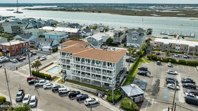 bird's eye view with a residential view and a water view