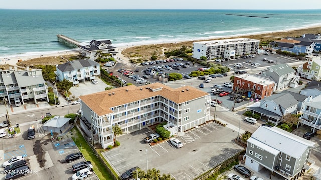 bird's eye view featuring a view of the beach and a water view