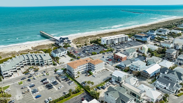 bird's eye view with a water view and a view of the beach