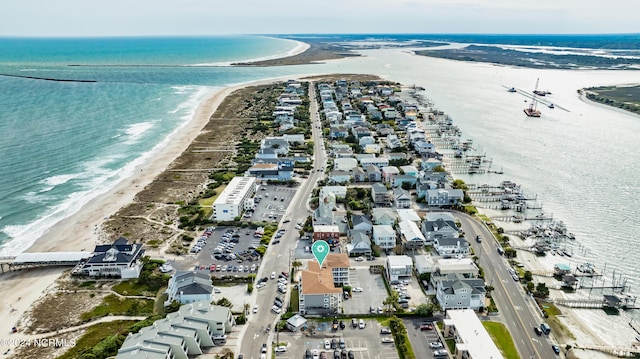 birds eye view of property featuring a view of the beach and a water view