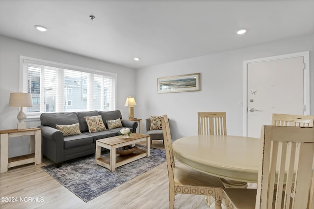 living area featuring recessed lighting and light wood finished floors