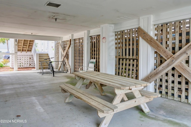 view of patio / terrace with visible vents and stairs