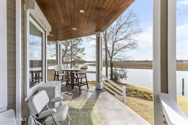 view of patio / terrace with a water view