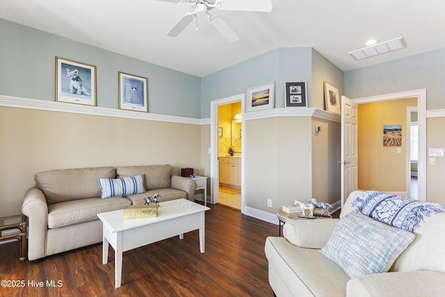 living area featuring visible vents, ceiling fan, and wood finished floors