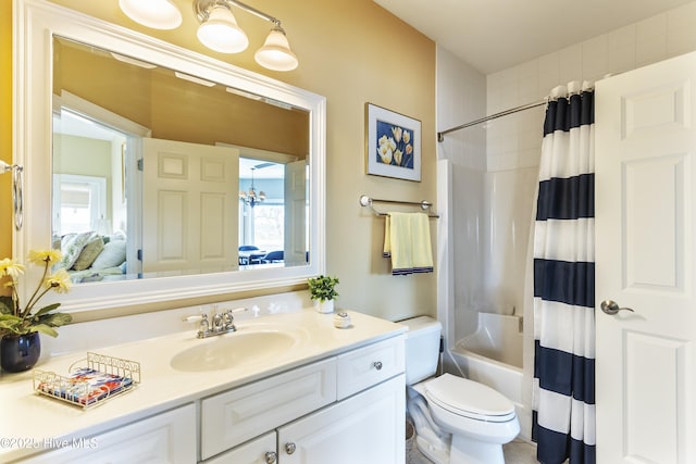 bathroom featuring vanity, toilet, shower / tub combo with curtain, and connected bathroom