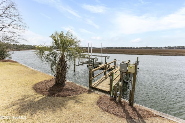 view of dock featuring boat lift and a water view