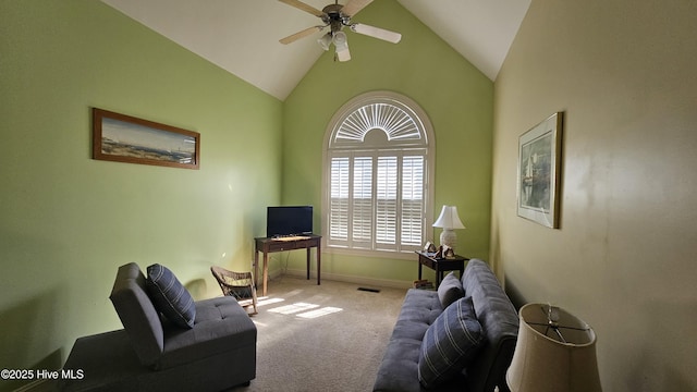 living room with carpet floors, vaulted ceiling, baseboards, and a ceiling fan