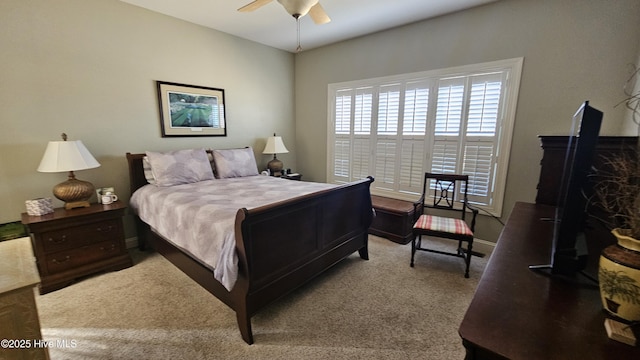 bedroom featuring ceiling fan, carpet floors, and baseboards