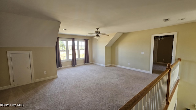 bonus room featuring visible vents, baseboards, ceiling fan, and carpet flooring