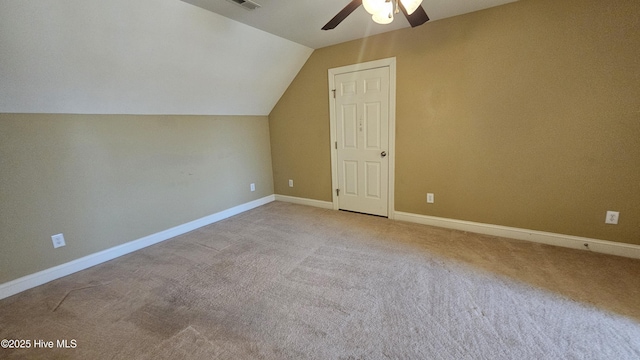 bonus room featuring visible vents, baseboards, a ceiling fan, vaulted ceiling, and carpet floors