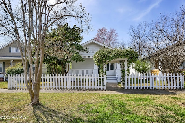 view of front of property featuring a porch and a fenced front yard