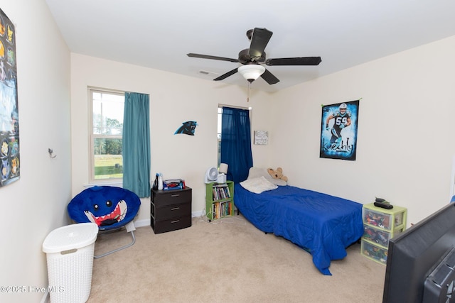 bedroom featuring visible vents, carpet flooring, and a ceiling fan