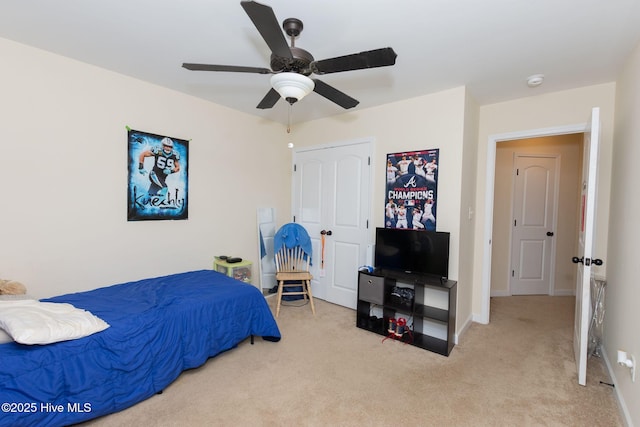 bedroom with carpet floors, a ceiling fan, and baseboards