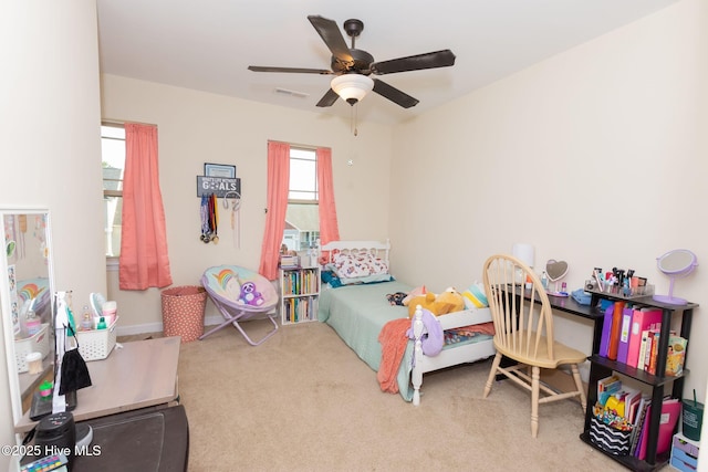 carpeted bedroom featuring visible vents and ceiling fan