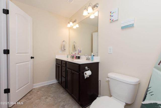 full bathroom with double vanity, visible vents, toilet, a sink, and baseboards