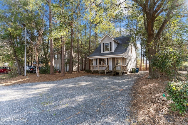 view of front of property with driveway and a porch