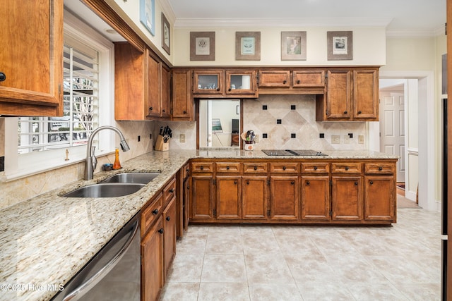 kitchen featuring crown molding, backsplash, a sink, and brown cabinets