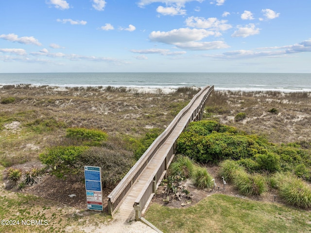 aerial view featuring a view of the beach and a water view