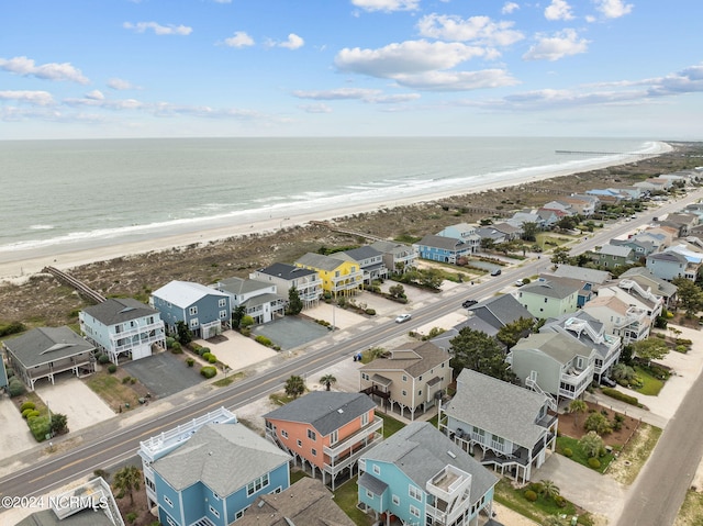 bird's eye view with a water view, a residential view, and a view of the beach