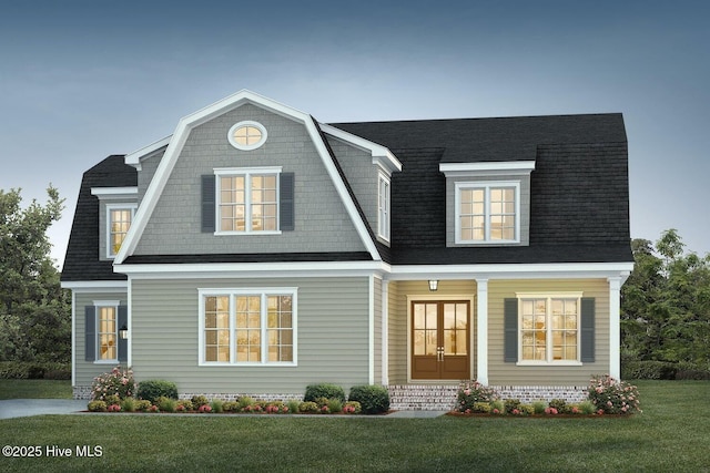 view of front of property featuring a front lawn, french doors, a shingled roof, and a gambrel roof