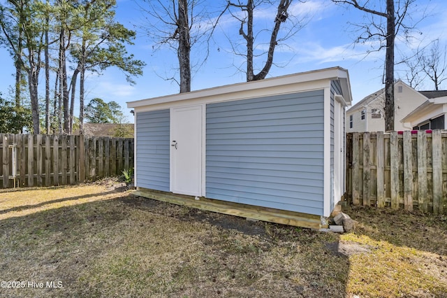 view of shed featuring a fenced backyard