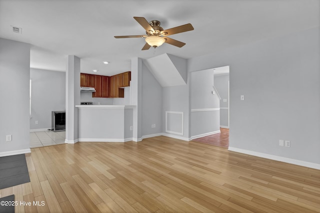 unfurnished living room with light wood finished floors, baseboards, visible vents, a ceiling fan, and recessed lighting