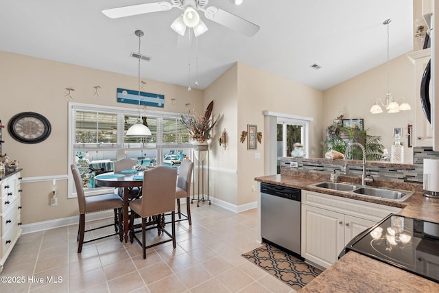 kitchen with a sink, range, visible vents, and stainless steel dishwasher