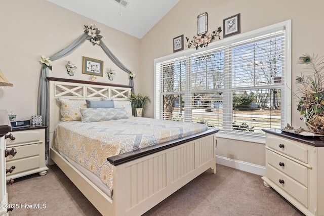 bedroom featuring baseboards, light carpet, lofted ceiling, and visible vents