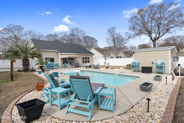 view of swimming pool with a fenced backyard, a fenced in pool, and a patio