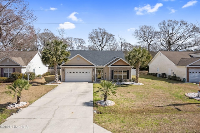 view of front of house with a garage, concrete driveway, and a front lawn