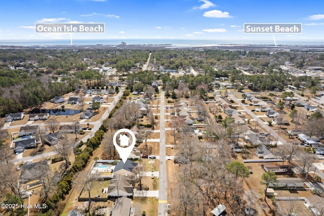 drone / aerial view with a residential view and a water view