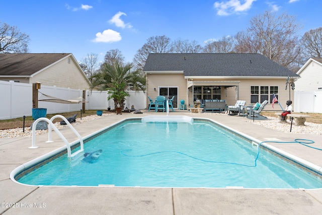 view of swimming pool with a patio, a fenced backyard, a fenced in pool, and an outdoor living space