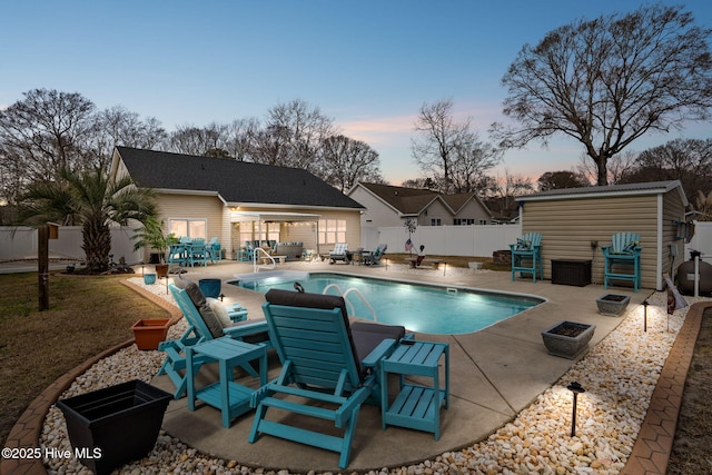 view of pool with a patio area, a fenced in pool, and a fenced backyard