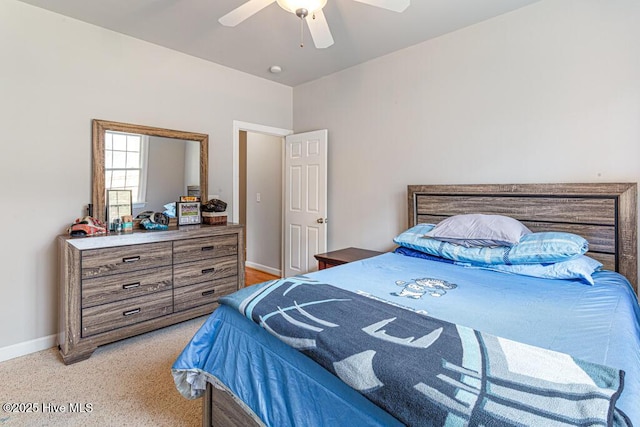 bedroom with ceiling fan and baseboards