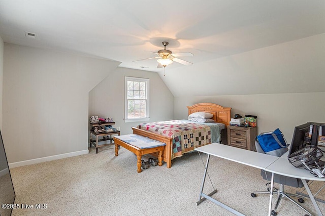 carpeted bedroom featuring ceiling fan, vaulted ceiling, visible vents, and baseboards