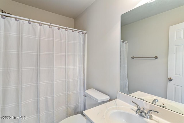 full bath with vanity and toilet