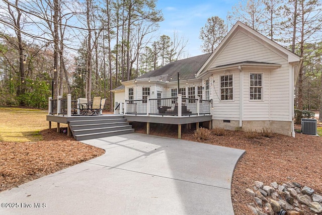 view of front of property with crawl space, central AC, and a wooden deck