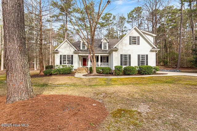 view of front facade with covered porch and a front lawn