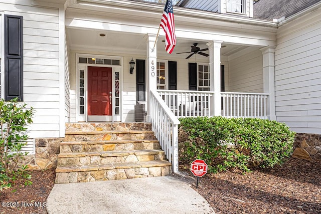 doorway to property with covered porch and a ceiling fan
