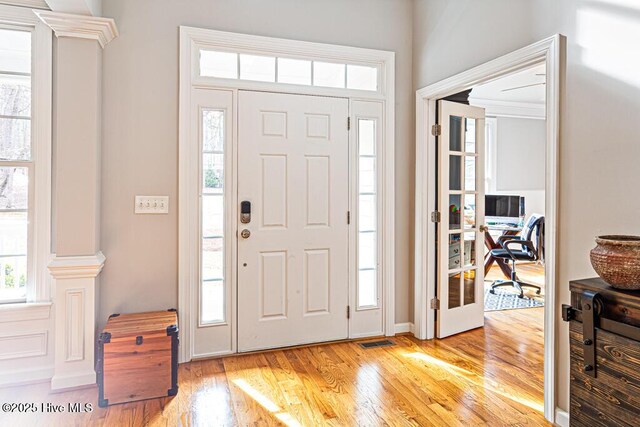 entrance foyer featuring light wood finished floors and visible vents