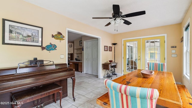 dining space featuring french doors and a ceiling fan