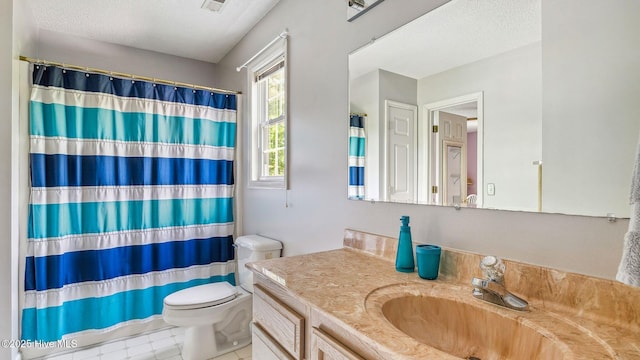 bathroom featuring vanity, a textured ceiling, curtained shower, and toilet