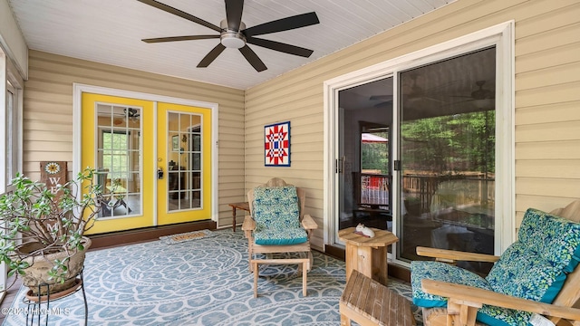 sunroom / solarium with french doors and ceiling fan