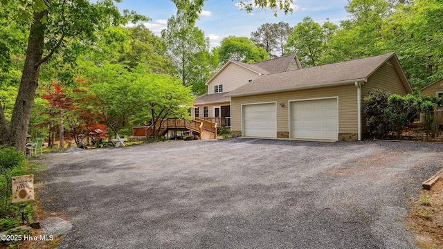 garage with aphalt driveway