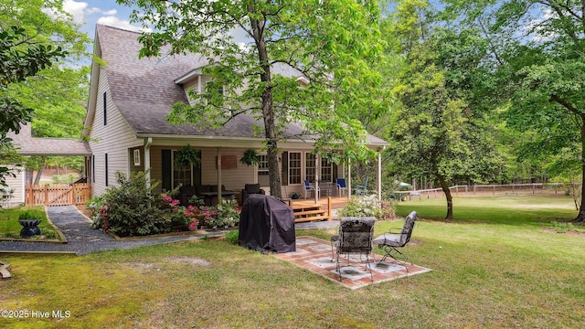 view of yard featuring fence, a gate, a patio area, and a deck