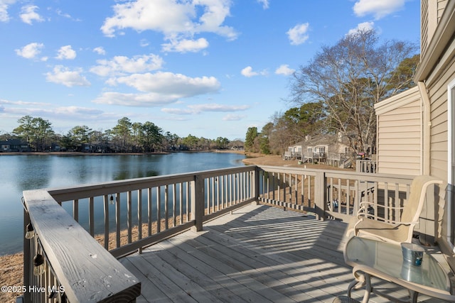 deck featuring a water view