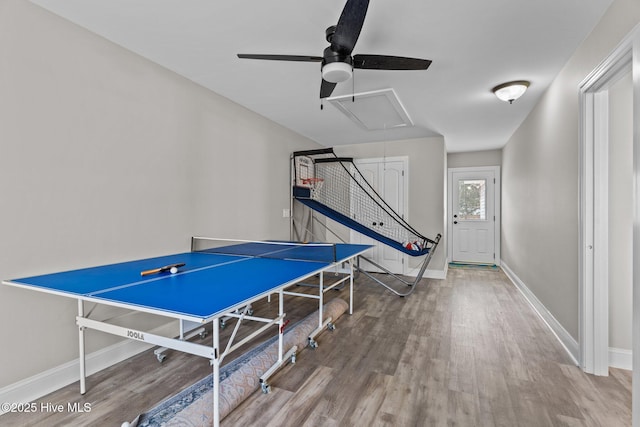 151 NE 9th St, Oak Island, NC 28465 - playroom featuring attic access, wood finished floors, ceiling fan, and baseboards